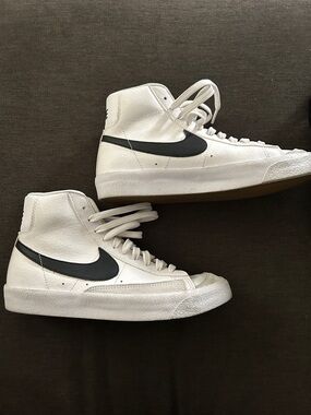 Nike High-Top White Sneakers with Black Swoosh